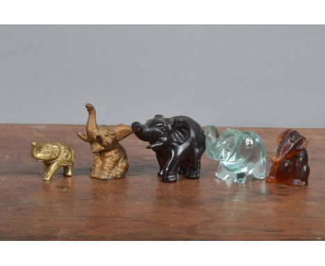 Five small Elephant figurines, comprising amber, gilt spelter, brass, glass and wood examples, of differing sizes, the larges