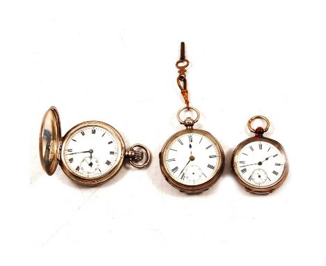 A silver full hunter pocket watch and two silver open face pocket watches, a silver full hunter pocket watch, the white ename