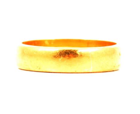 A 22 carat yellow gold wedding band, 4.8mm wide plain polished D shape, hallmarked Chester 1958, ring size N1/2, 5g.