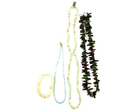 Three gemset necklaces and a bracelet, a ruby in zoisite polished chip necklace, unmarked white metal T-bar and hoop clasp, 7