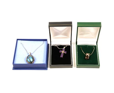 Nine gemset pendants with chains, ruby in zoisite, kyanite, labradorite, smoky quartz and others, a ruby in zoisite pendant a