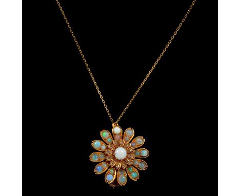 An opal and diamond floral pendant brooch and chain, the central cabochon cut opal surrounded by twelve diamond chip set leav