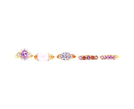 Eight purple gemstone rings, natural and synthetic gemstones, a cluster ring with four small diamonds, another cluster ring, 