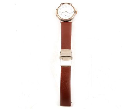 A 1918 silver trench watch, 28mm circular white enamel dial with Arabic numerals and subsidiary seconds dial in a 33mm plain 