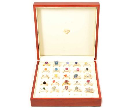 Twenty-five gemset silver rings, amethyst, fluorite, lapis lazuli, opal, ruby, a Zambian amethyst and white topaz ring, in a 