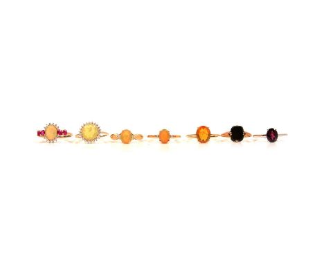 Seven gemset gold rings, Ethiopian opal and others, an Ethiopian opal and white zircon ring, in a 9 carat yellow gold mount r