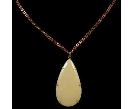An opal pendant and chain, the pear shape cabochon cut opal, 40x22mm, claw set to an unmarked yellow metal frame, on a 2.7mm 