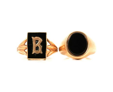 Two 9 carat yellow gold / yellow metal signet rings, a 9 carat yellow gold onyx signet ring size S1/2, gross weight 8.6g; and