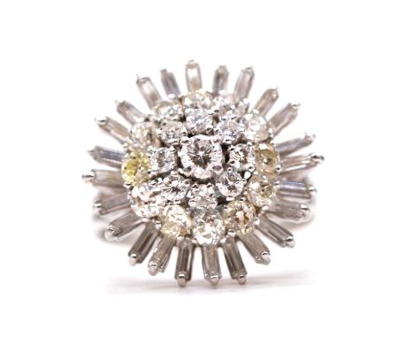 A large multi stone diamond cluster ring, a central three tier cluster of twenty-one old and modern brilliant cut diamonds su