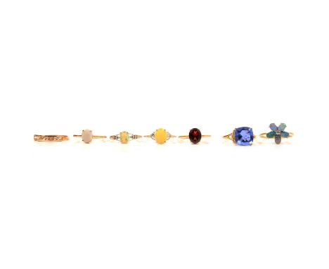 Seven gemset gold rings, colour change fluorite, boulder opal and others, a colour change fluorite ring, in a 9 carat yellow 