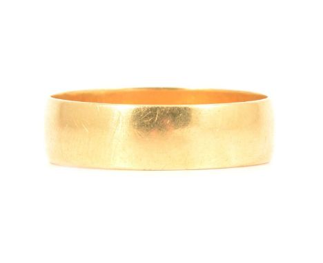 An 18 carat yellow gold wedding band, 6.1mm wide plain polished band, hallmarked London 1992, ring size T, 3.9g.