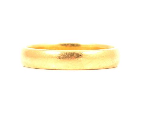 A 22 carat yellow gold wedding band, 4mm wide plain polished D shape, hallmarked Birmingham 1978, ring size O, 5.3g.