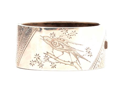A Victorian silver half hinged bangle, Birmingham 1881, Haseler Brothers, 30mm wide flat section engraved with a bird on a br