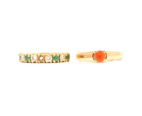 An emerald and diamond half hoop ring and a fire opal solitaire ring, an emerald and diamond half hoop ring, the four round b