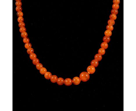 Amber style jewellery, silver bangle and ring, an amber style graduated bead necklace, 45cm; another, 43cm; an amber style pa
