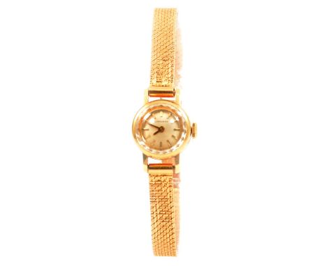 Longines - a lady's 18 carat yellow gold bracelet watch, 10mm circular champagne baton dial with a part faceted glass in an 1