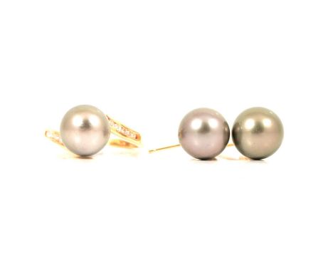 A modern cultured Tahitian pearl and diamond crossover ring and pair of earrings, a modern cultured Tahitian pearl and diamon