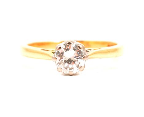 A diamond solitaire ring, the brilliant cut stone eight claw set in an 18 carat yellow and white gold mount ring size M, appr