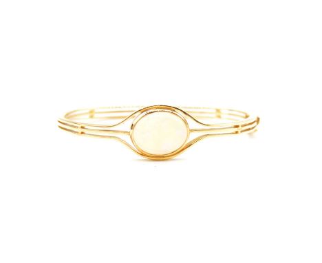 An opal half hinged bangle, an oval cabochon cut opal, 16x13mm, collet set in an 18 carat yellow gold hand made half hinged b