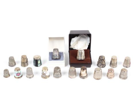 A collection of imported silver and white metal thimbles, including engraved and enamelled examples, not hallmarked, some sta