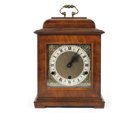 A George III style mahogany bracket clock, the brass dial with a 5" silvered chapter ring on an 8 day, three train movement c