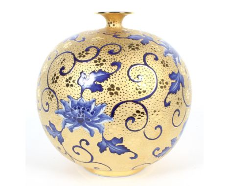 A modern Chinese vase, of spherical form, decorated with underglaze cobalt blue flowers and foliage on a textured and burnish