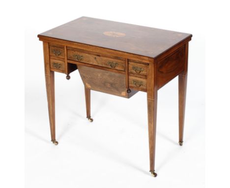 A Victorian rosewood and inlaid sewing or work table, the inlaid, folding and rotating top enclosing a card table above a cen