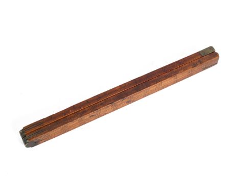 An antique folding wooden brass-mounted alcohol barrel measuring stick, 122 cm long 