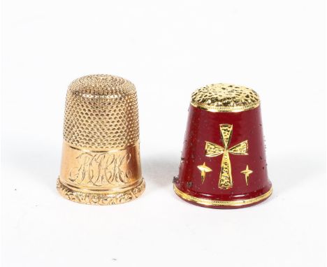 A yellow metal thimble, with scrolling initials and foliate decoration to the rim, stamped '9', 4.9 grams approx; and another