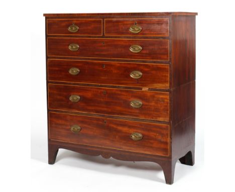 A George III mahogany chest of drawers, inlaid with satinwood stringing throughout, with two short drawers above four graduat