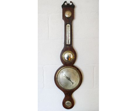 A 19th century mahogany wheel barometer, with silvered hygrometer, thermometer gauge, main dial and spirit level, 96cm