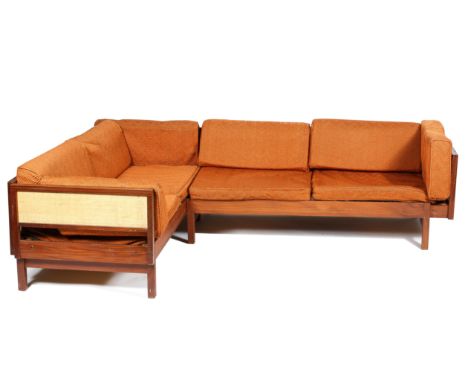 A pair of mid 20th century sofa or day bed, probably Danish, teak with woven rattan panels and orange fabric cushions, 60cm h