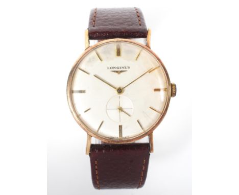 A Longines wrist watch, with subsidiary seconds dial, baton numerals, manual wind, the case probably 9ct gold but back not re