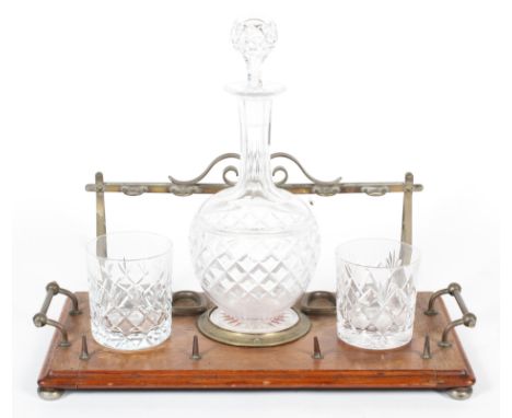 A Victorian oak and brass-mounted pipe rack and a decanter stand, with globe shaped cut-glass decanter and two tumblers, 41 c