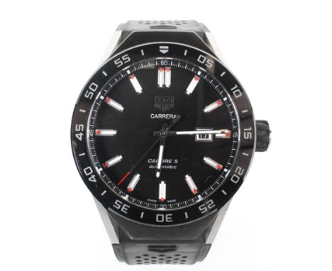 A Gents Tag Heuer Carrera calibre 5 automatic wristwatch, the black dial with batons denoting hours, date aperature at the qu