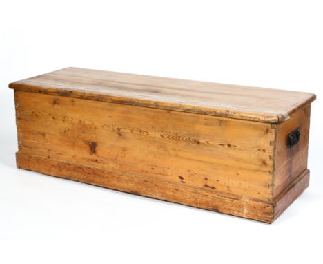 A 19th century rectangular pine trunk, with swing handles, on plinth base, 50 cm high x 161 cm x 55 cm deep 