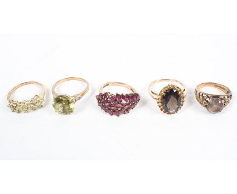 A collection of five gemstone set dress rings. Size range from N to R. Gross weight: 17.5 grams