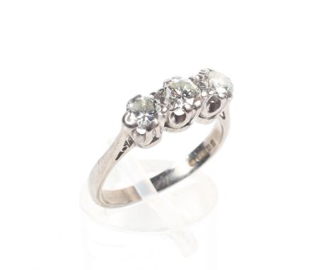 A white metal three stone ring set with round brilliant cut diamonds estimated to weigh a total of 0.75cts. Colour K/L Clarit