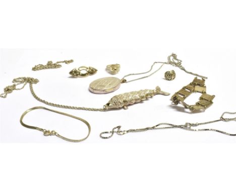 AN ASSORTMENT OF SILVER ITEMS To include a modern articulate fish pendant on chain, an oval engraved locket, a silver rose ri