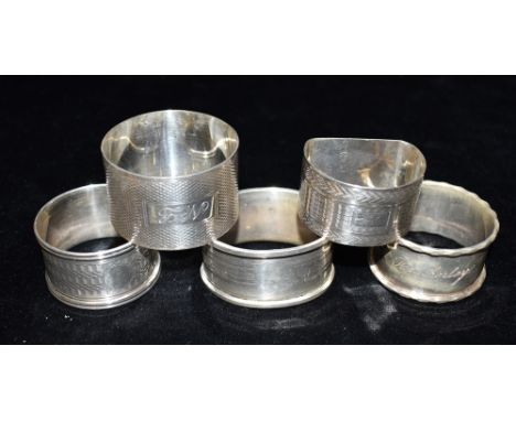 ASSORTED ENGRAVED SILVER NAPKIN RINGSFive napkin rings some with fine engine turned decoration and several with engraved mono