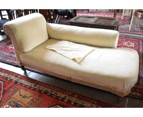 A RE-UPHOLSTERED EDWARDIAN CHAISE LONGUE  on turned supports with ceramic casters, 170cm long 70cm deep 72cm high Condition R