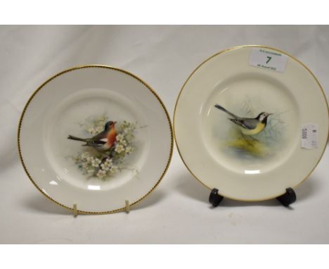 A pair of Royal Worcester porcelain cabinet plates, hand painted with birds, diameter 15cm
one at 15cm the other 15.5cm both 