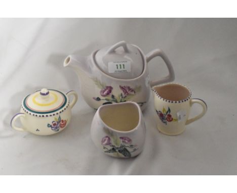 A Carleton ware Australian design teapot and sugar basin, sold with a Poole Pottery handled sugar basin and milk jug.
