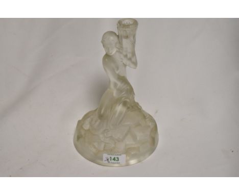 An Art Deco moulded glass lamp base in the style of Lalique, depicting nude maiden on rocks holding vase aloft, AF chips to t