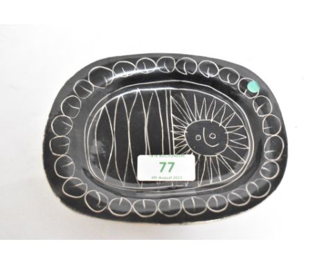 A Jacques Pouchain ceramic dish, decorated with a Picassso style illustration on black ground, 15cm longCondition report - Ov