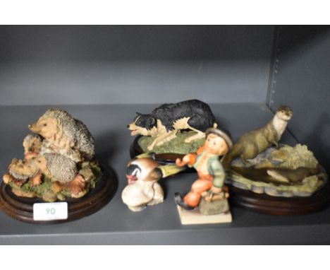 Three mounted models of animals, by Royal Doulton and Border Fine Arts, and to include a hedgehog figure group, plus a Royal 