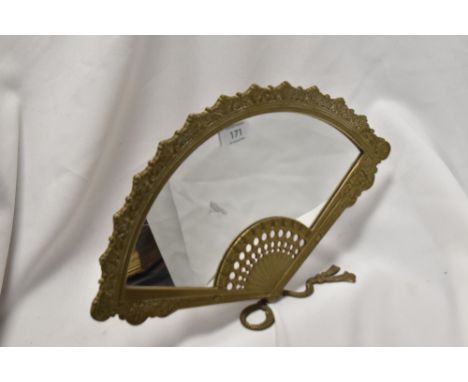 A cast-brass dressing table mirror, modelled as an opened fan, with easel type stand to reverse