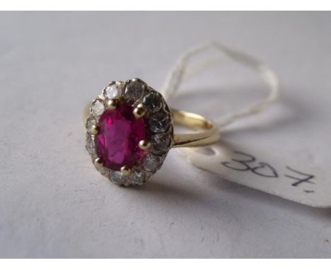 A GOOD 18CT GOLD MOUNTED RUBY &  diamond cluster ring approx 'M'      