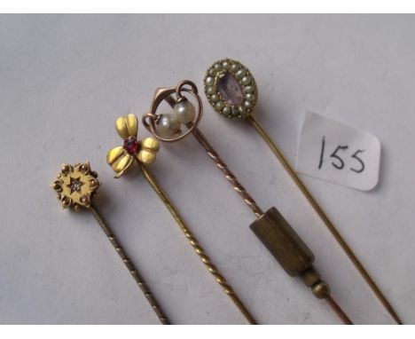 Four various stone set gold topped  stick pins        