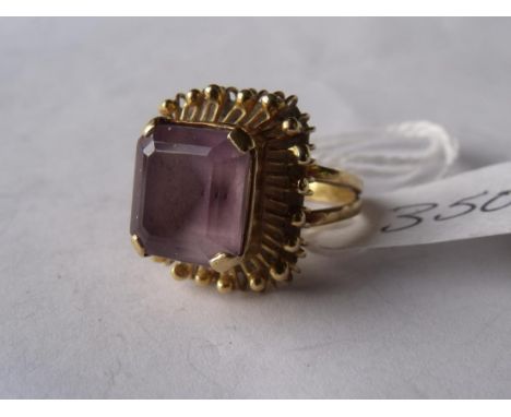 An unusual high carat gold amethyst set ring  approx size 'K' 7.5g       